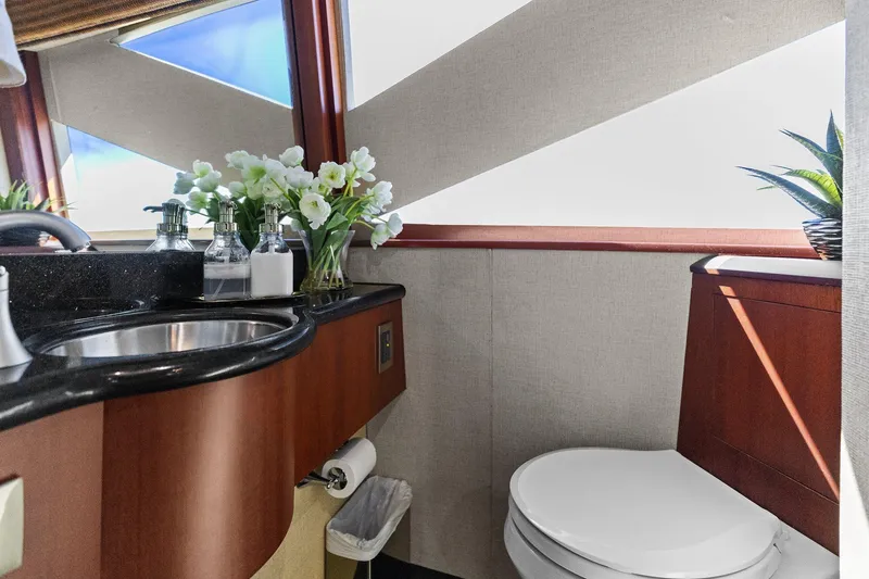 Slide: The Image of Luxurious Lazzara yacht bathroom with elegant sink, flowers, and modern decor. - 51