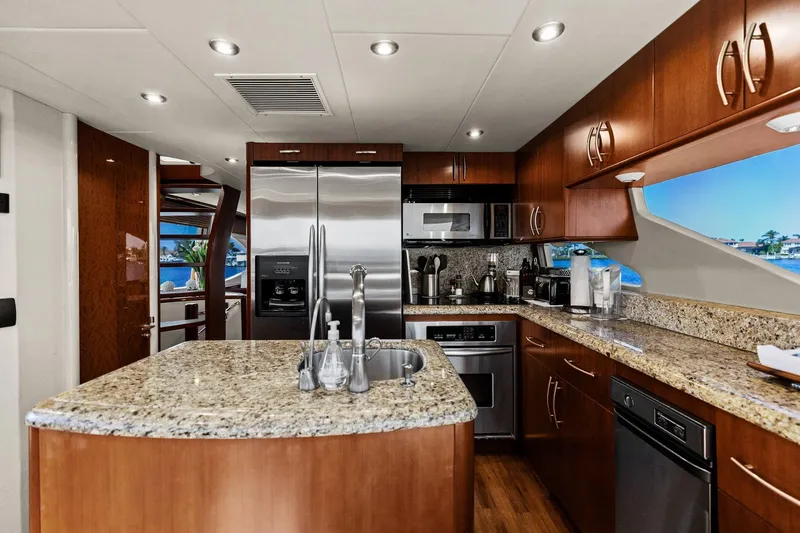Slide: The Image of Luxurious Lazzara yacht kitchen with granite countertops and stainless steel appliances. - 59