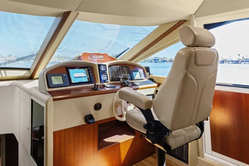 Slide: The Image of Luxurious Lazzara yacht helm with advanced navigation systems and comfortable captain's chair. - 63
