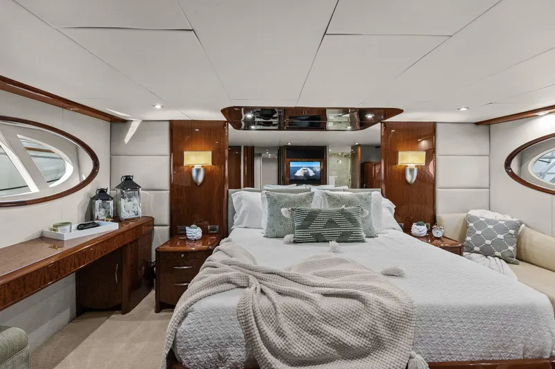 Slide: The Image of Luxurious Lazzara yacht bedroom with elegant decor, plush bedding, and ambient lighting. - 67