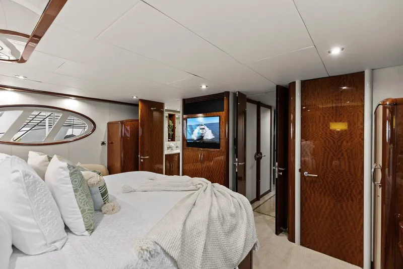 Slide: The Image of Luxurious Lazzara yacht bedroom with elegant wood finishes and modern decor. - 68