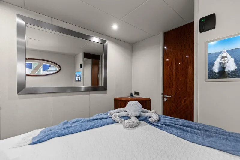 Slide: The Image of Luxurious Lazzara yacht cabin with elegant decor and plush bedding. - 78