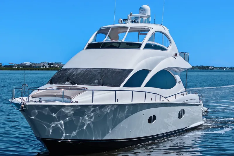 Slide: The Image of Luxurious Lazzara yacht cruising on a clear blue sea under a bright sky. - 8