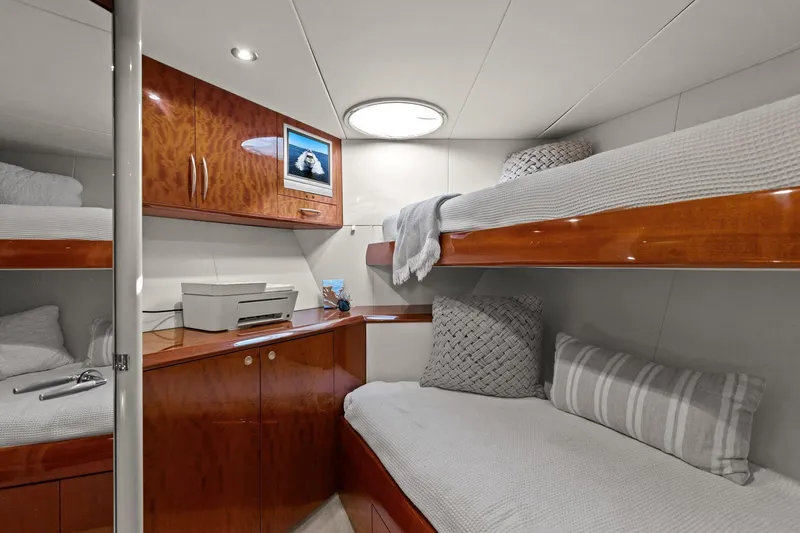 Slide: The Image of Luxurious Lazzara yacht cabin with wooden bunk beds and modern decor. - 88