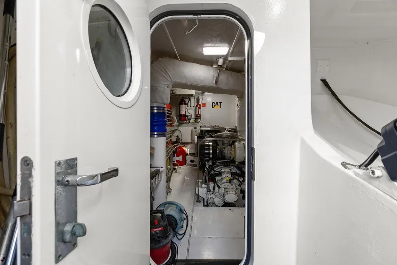 Slide: The Image of Engine room of a Lazzara yacht with visible CAT machinery and equipment. - 96
