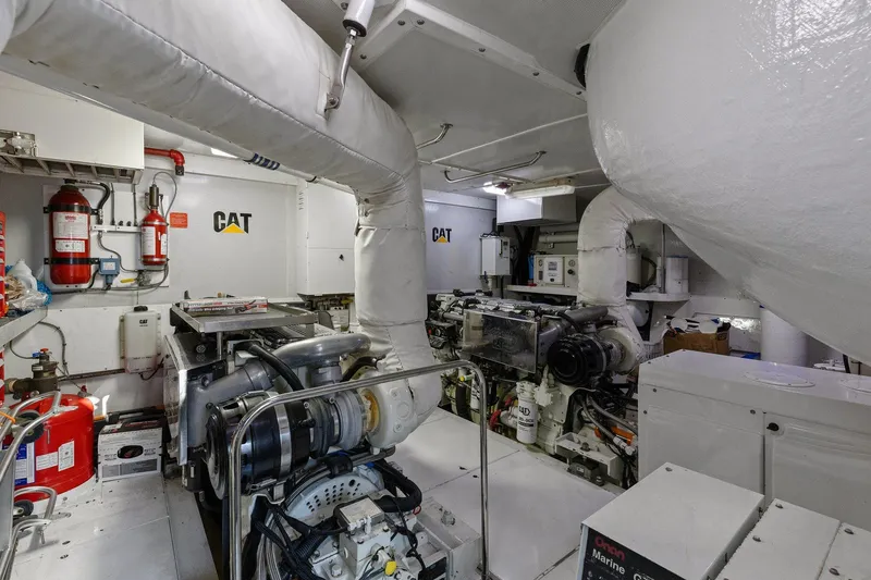 Slide: The Image of Engine room of a Lazzara yacht featuring CAT machinery and fire safety equipment. - 97