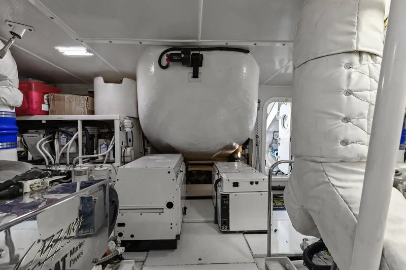 Slide: The Image of Engine room of a Lazzara yacht with machinery and equipment. - 98