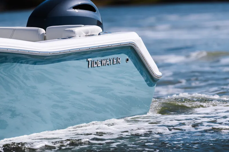 Slide: The Image of 2026 Tidewater 220 LXF boat on the water. - 2