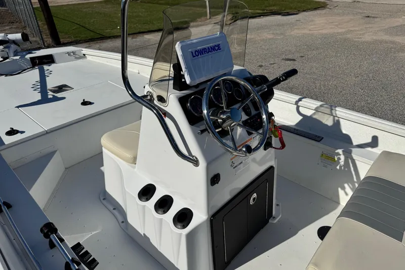 Slide: The Image of Center console of 2023 G3 Bay 17 boat with steering wheel and navigation system. - 10