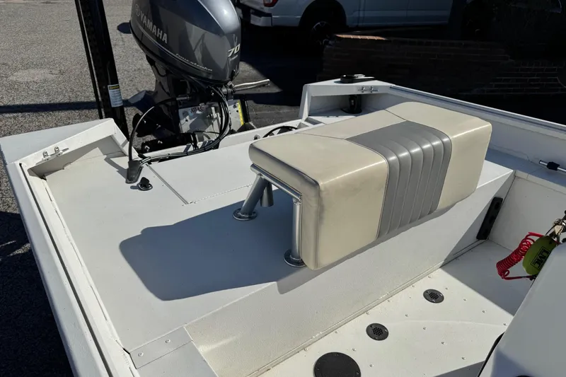 Slide: The Image of 2023 G3 Bay 17 boat with Yamaha 70 engine, featuring a cushioned seat. - 11