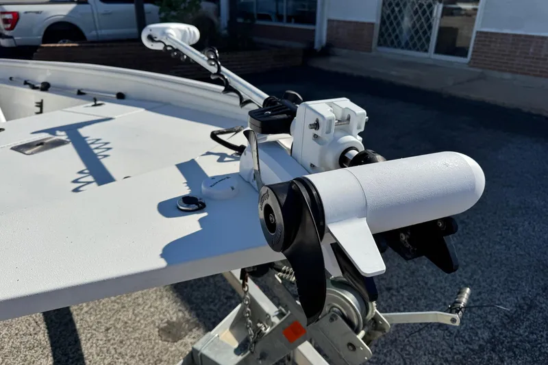 Slide: The Image of 2023 G3 Bay 17 boat with a mounted trolling motor on the deck. - 12