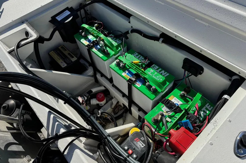 Slide: The Image of Battery compartment of 2023 G3 Bay 17 boat with green Interstate batteries. - 18