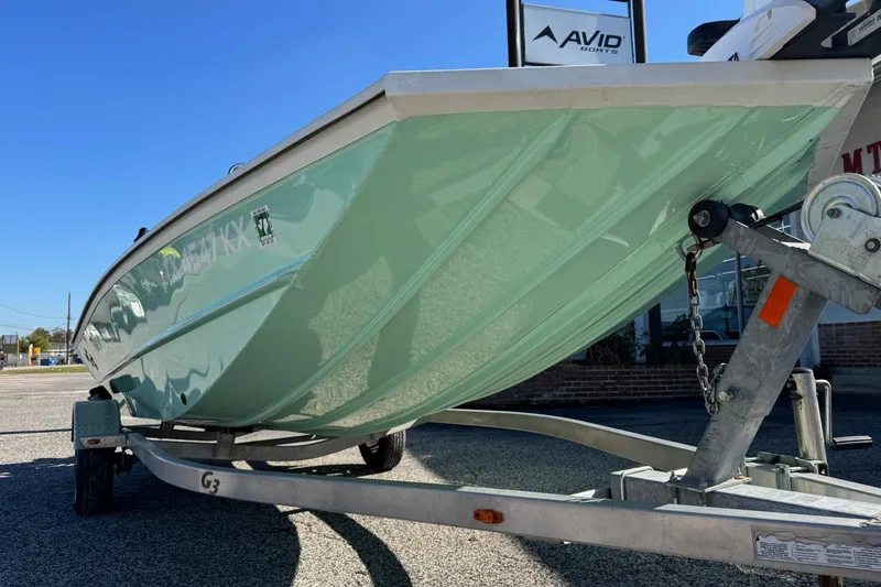 Slide: The Image of 2023 G3 Bay 17 boat on trailer, mint green hull, sunny day. - 4