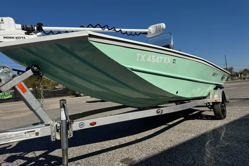Slide: The Image of 2023 G3 Bay 17 boat on trailer, mint green hull, Minn Kota motor. - 5