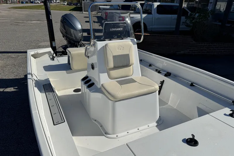 Slide: The Image of 2023 G3 Bay 17 boat with center console and Yamaha motor in a parking lot. - 8
