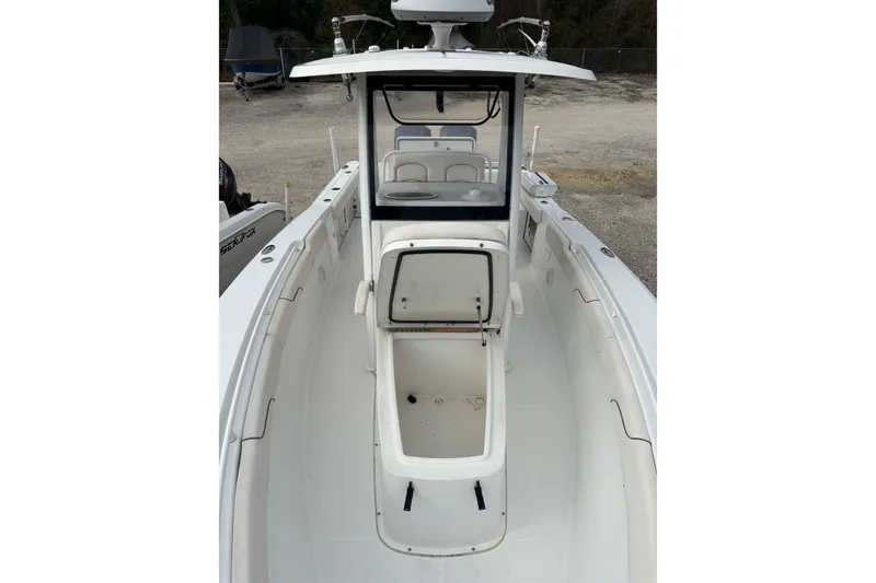 Slide: The Image of 2019 Sea Hunt Gamefish 27 Coffin Box boat, open deck view, white interior. - 10