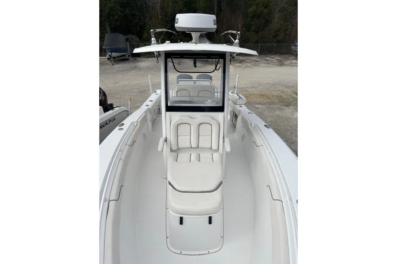 Slide: The Image of 2019 Sea Hunt Gamefish 27 Coffin Box boat with white seating and console. - 11