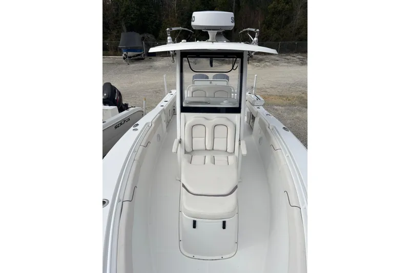 Slide: The Image of 2019 Sea Hunt Gamefish 27 Coffin Box boat interior with seating and console. - 12