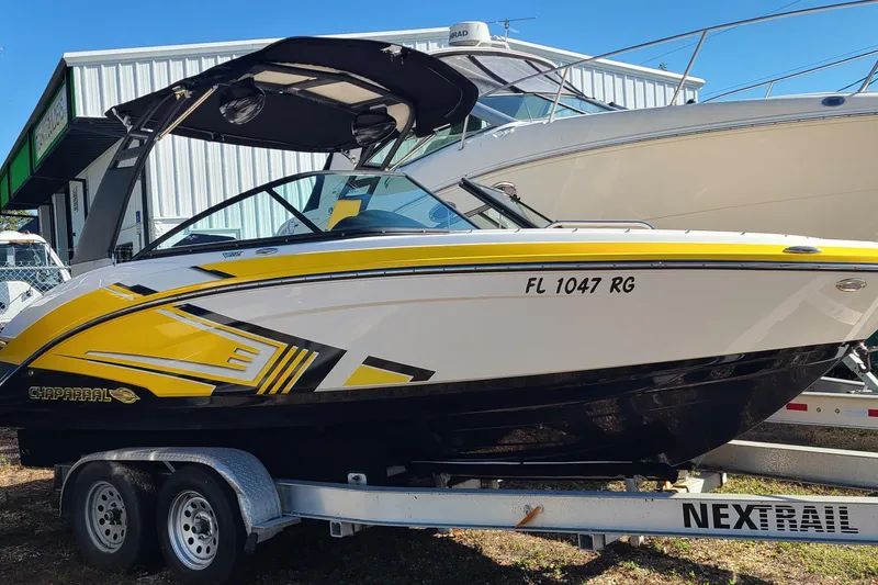 The Image of 2017 Chaparral Vortex 203 VRX boat on trailer, yellow and white design. - 0