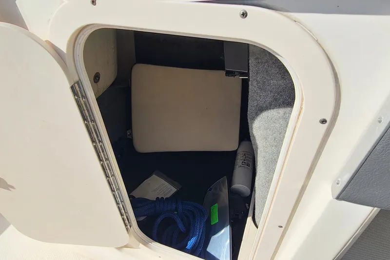 Slide: The Image of Storage compartment of 2017 Chaparral Vortex 203 VRX boat with rope and equipment. - 14