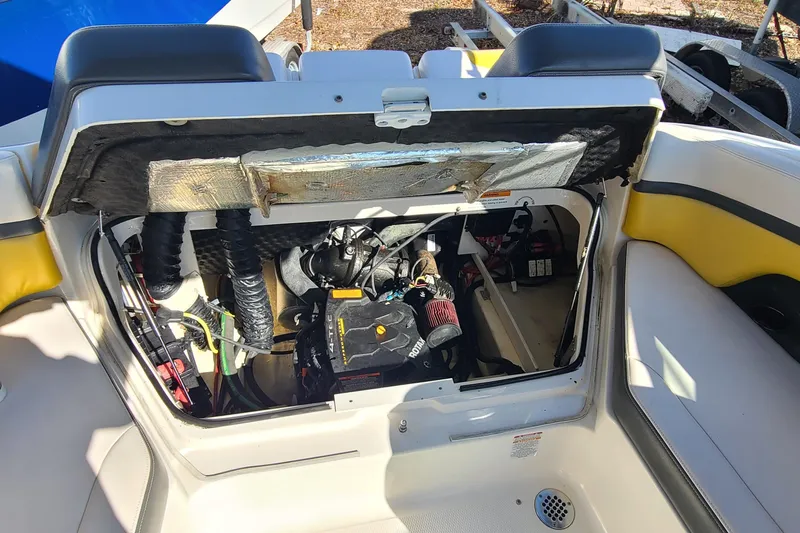 Slide: The Image of 2017 Chaparral Vortex 203 VRX engine compartment with open hatch, showcasing internal components. - 17