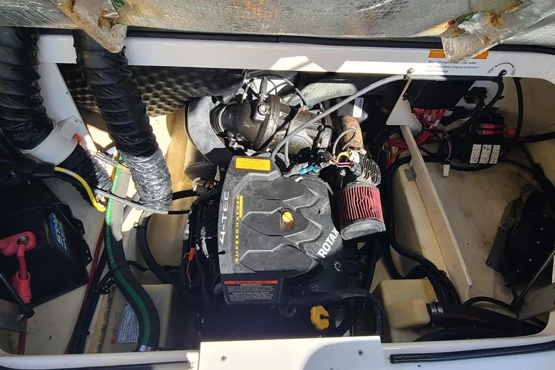 Slide: The Image of Engine compartment of 2017 Chaparral Vortex 203 VRX boat, showcasing Rotax engine components. - 18