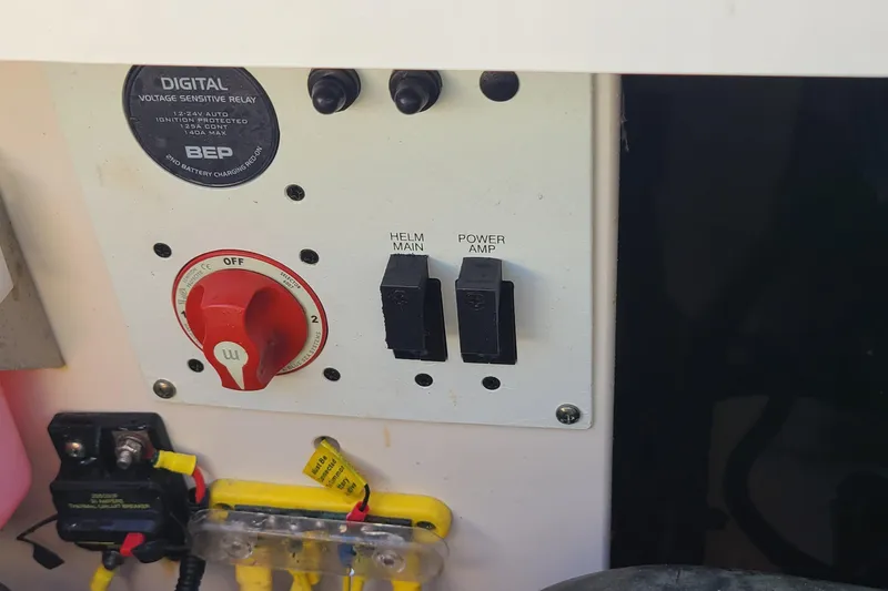 Slide: The Image of Control panel of a 2017 Chaparral Vortex 203 VRX boat with switches and voltage relay. - 20