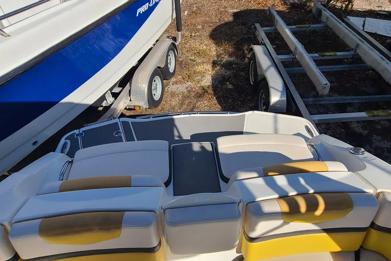 Slide: The Image of 2017 Chaparral Vortex 203 VRX boat interior with yellow and white seating. - 23