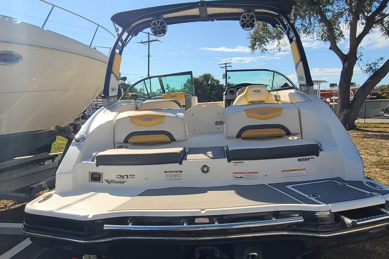 Slide: The Image of 2017 Chaparral Vortex 203 VRX boat, rear view, parked outdoors under clear sky. - 24