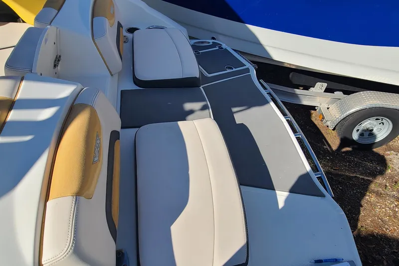 Slide: The Image of 2017 Chaparral Vortex 203 VRX boat interior with cushioned seating and trailer. - 25