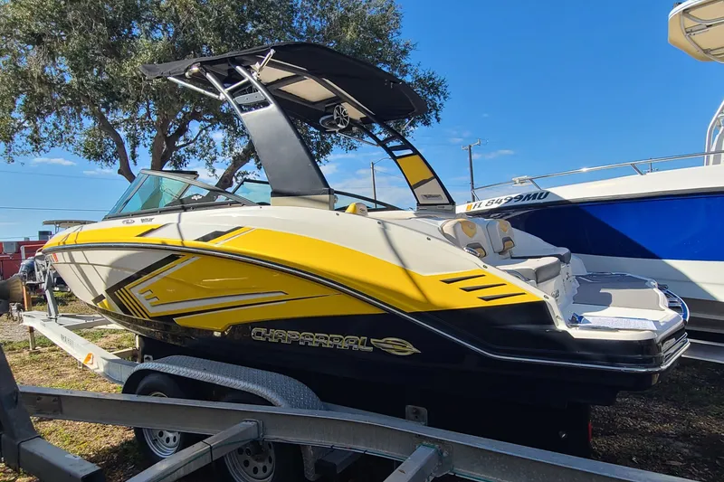 Slide: The Image of 2017 Chaparral Vortex 203 VRX boat with vibrant yellow accents on a trailer. - 3