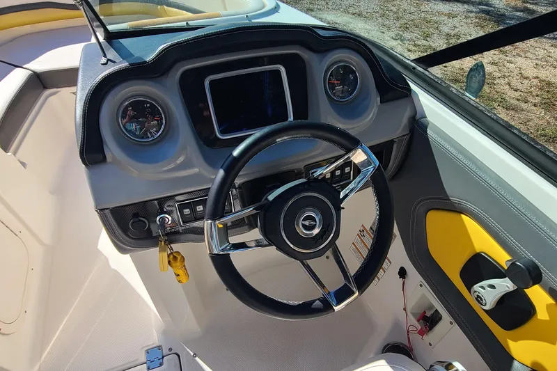 Slide: The Image of 2017 Chaparral Vortex 203 VRX boat dashboard with steering wheel and gauges. - 7
