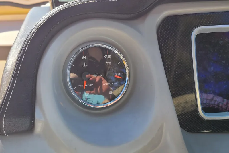 Slide: The Image of Dashboard gauge of a 2017 Chaparral Vortex 203 VRX boat, showing temperature and voltage. - 8