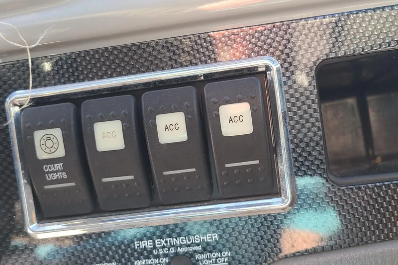 Slide: The Image of Control panel of a 2017 Chaparral Vortex 203 VRX with switches for court lights and accessories. - 9