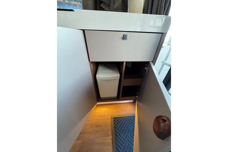 Slide: The Image of 2025 Beneteau Antares 11 Fly interior cabinet with modern design and ambient lighting. - 15