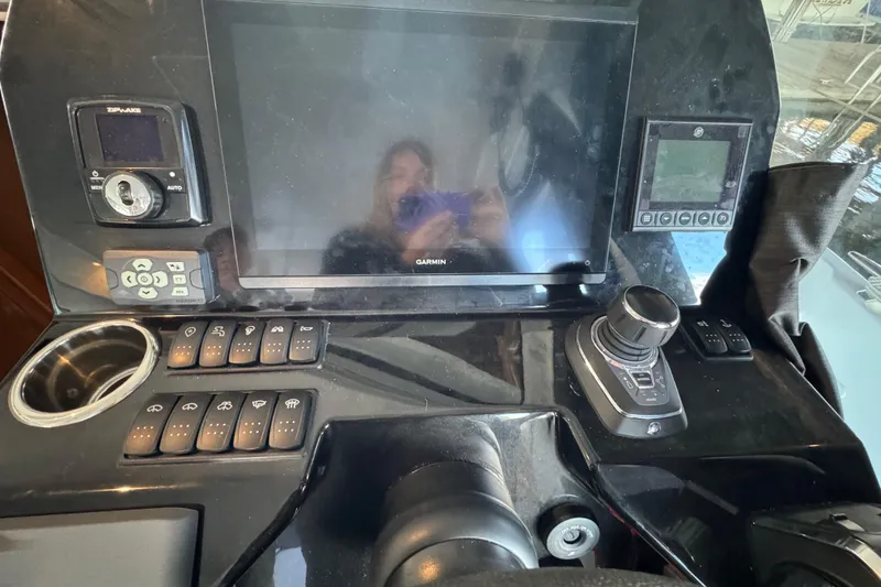 Slide: The Image of Control panel of 2025 Beneteau Antares 11 Fly with navigation and joystick controls. - 18