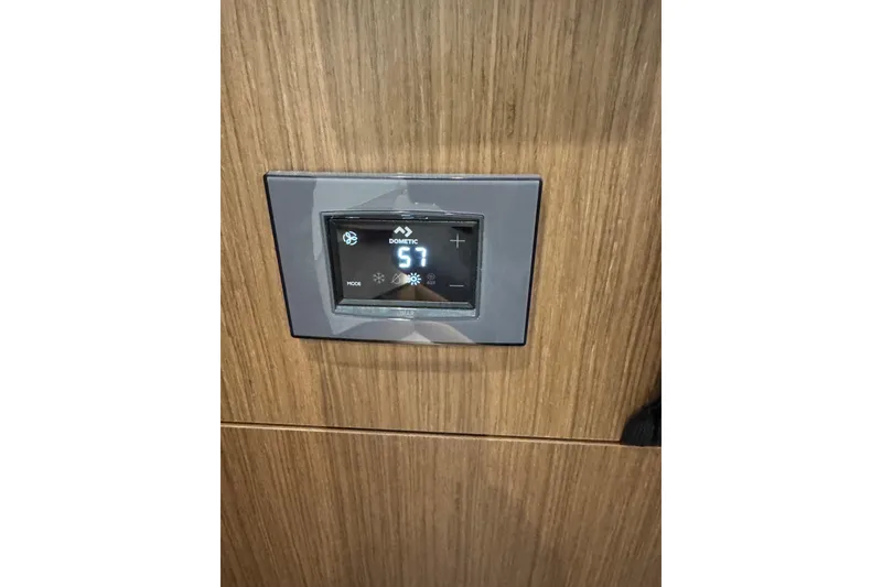 Slide: The Image of Digital control panel on 2025 Beneteau Antares 11 Fly yacht interior. - 28