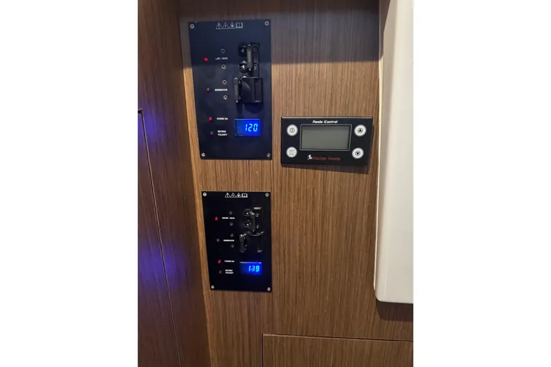 Slide: The Image of Control panel on 2025 Beneteau Antares 11 Fly yacht, featuring digital displays and switches. - 29