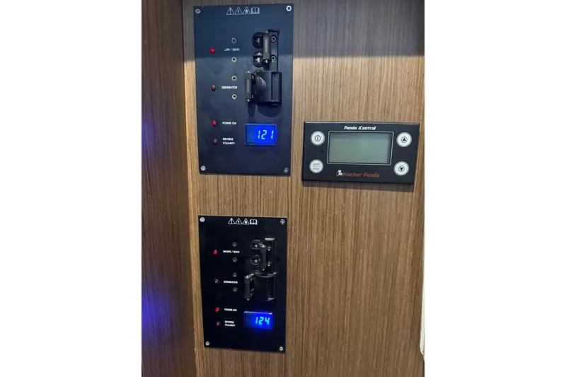 Slide: The Image of Control panel of 2025 Beneteau Antares 11 Fly with digital displays and switches. - 31