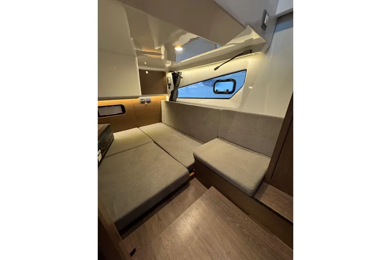 Slide: The Image of Interior of 2025 Beneteau Antares 11 Fly, featuring cozy seating and modern design. - 33