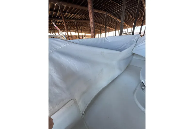 Slide: The Image of 2025 Beneteau Antares 11 Fly under cover in a wooden boathouse. - 44