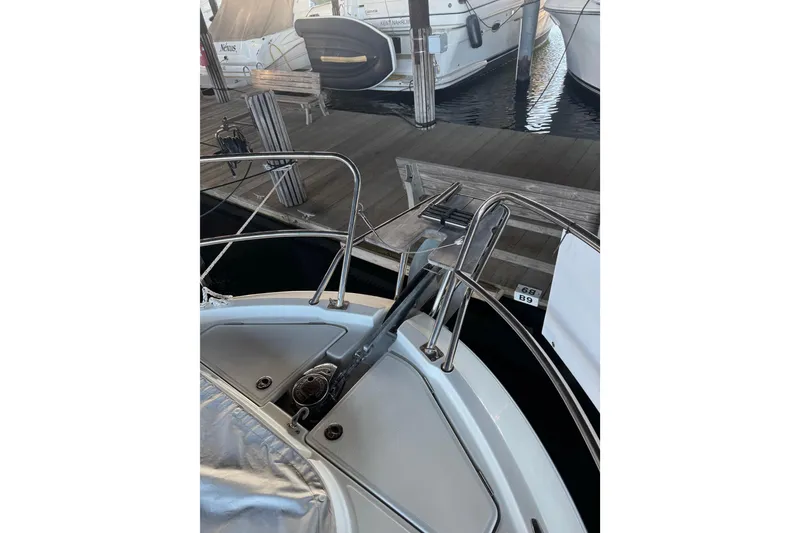 Slide: The Image of 2025 Beneteau Antares 11 Fly yacht docked, showcasing bow and anchor details. - 47