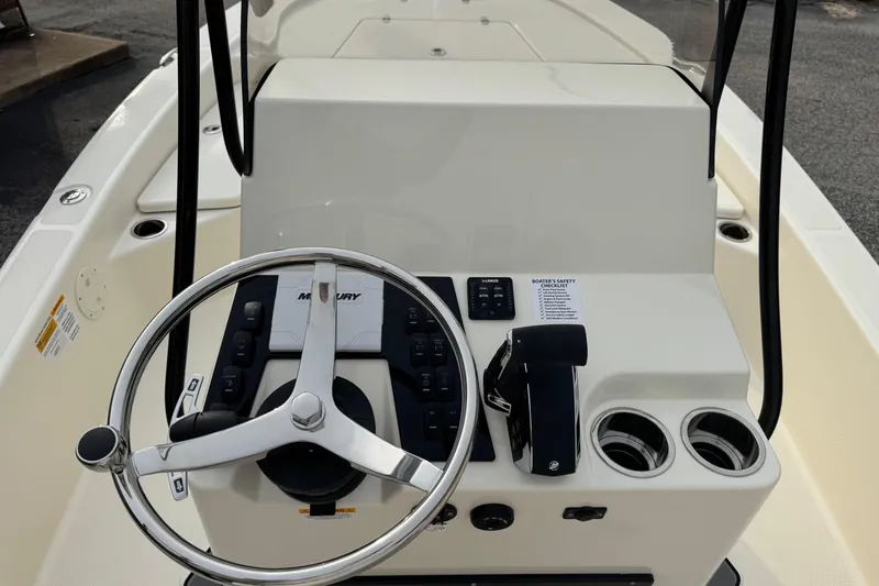 Slide: The Image of 2026 BlackJack 224 boat console with steering wheel and controls. - 15