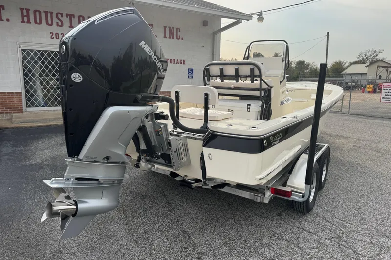 Slide: The Image of 2026 BlackJack 224 boat with Mercury outboard motor on a trailer. - 3