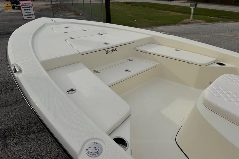 Slide: The Image of 2026 BlackJack 224 boat deck with storage compartments and seating. - 9