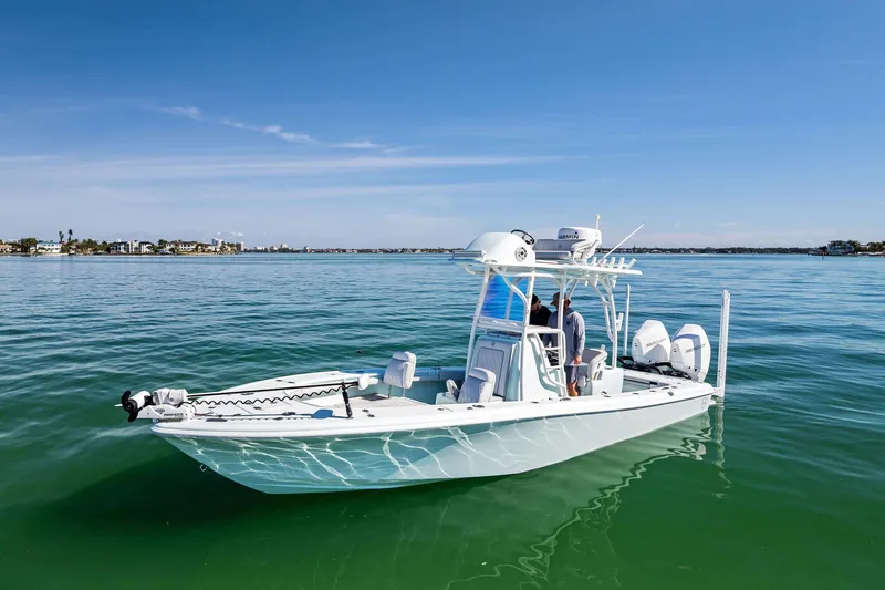 The Image of 2023 Barker Boatworks 26 Open on calm water, showcasing sleek design and modern features. - 0