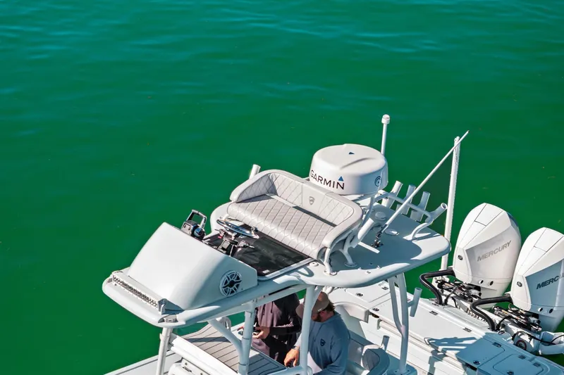 Slide: The Image of 2023 Barker Boatworks 26 Open on water, featuring Garmin equipment and Mercury engines. - 10