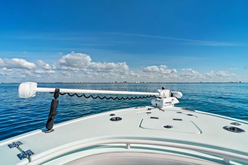 Slide: The Image of 2023 Barker Boatworks 26 Open on calm blue waters under a clear sky. - 14