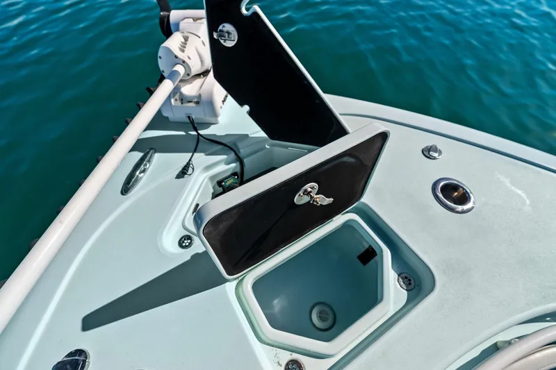 Slide: The Image of 2023 Barker Boatworks 26 Open bow storage compartment on calm blue water. - 15
