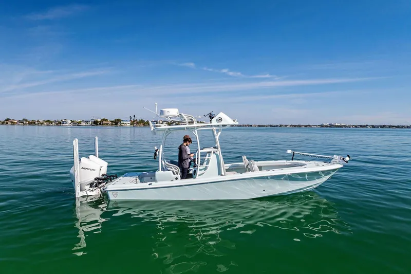Slide: The Image of 2023 Barker Boatworks 26 Open on calm water, showcasing sleek design and modern features. - 2